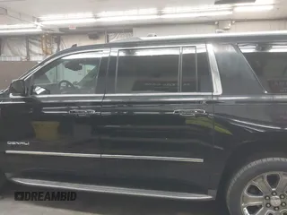 2016 GMC Yukon XL Denali with VIN 1GKS2HKJ8GR102213, listed as a IAAI auction lot 41818737 with 154,607 mi miles and . Bid and sale history available at DreamBid. Image 14.