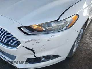 2016 Ford Fusion Titanium Hybrid with VIN 3FA6P0RU1GR191813, listed as a IAAI auction lot 41560954 with 86,922 mi miles. Bid and sale history available at carsss.com. Image 12.