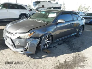 2016 Scion tC with VIN JTKJF5C78GJ014184, listed as a IAAI auction lot 41622575 with 128,520 mi miles. Bid and sale history available at carsss.com. Image 17.