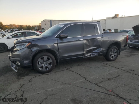 2020 Honda Ridgeline RTL-E with VIN 5FPYK3F73LB010893, listed as a Copart auction lot 82676714 with 71,903 mi miles and Salvage Title. Bid and sale history available at carsss.com. Image 1.