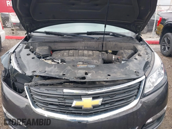 2015 Chevrolet Traverse LS z VIN 1GNKRFKDXFJ107942, wystawiony jako IAAI lot #42111246 z przebiegiem 128 036 mil mil oraz . Historia ofert i sprzedaży dostępna na DreamBid. Obrazek 10.