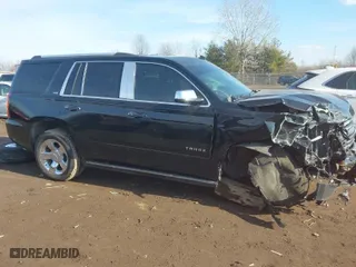 2015 Chevrolet Tahoe LTZ with VIN 1GNSKCKC5FR115779, listed as a IAAI auction lot 41538240 with 155,271 mi miles. Bid and sale history available at carsss.com. Image 14.
