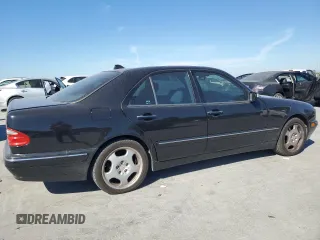 2000 Mercedes-Benz E-Class with VIN WDBJF70JXYB091085, listed as a Copart auction lot 77136484 with 185,429 mi miles and Salvage Title. Bid and sale history available at carsss.com. Image 3.