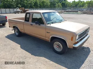 1988 Ford Ranger z VIN 1FTCR14TXJPB09796, wystawiony jako IAAI lot #42657375 z przebiegiem 67 118 mil mil oraz . Historia ofert i sprzedaży dostępna na DreamBid. Obrazek 1.