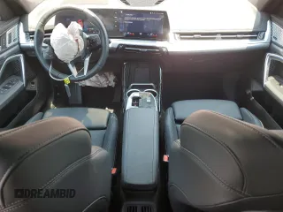 2023 BMW X1 xDrive28i with VIN WBX73EF03P5W54209, listed as a Copart auction lot 64796365 with 19,591 mi miles and Salvage title. Bid and sale history available at DreamBid. Image 8.