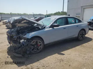 2025 BMW i5 M60 with VIN WBY43FK0XSCU73221, listed as a Copart auction lot 61084385 with 694 mi miles and Salvage title. Bid and sale history available at DreamBid. Image 1.
