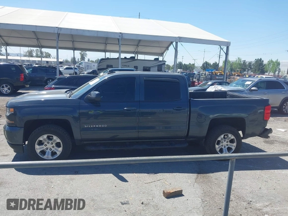 2018 Chevrolet Silverado 1500 LT with VIN 3GCUKREC1JG511846, listed as a IAAI auction lot 42024170 with 121,532 mi miles and . Bid and sale history available at DreamBid. Image 14.