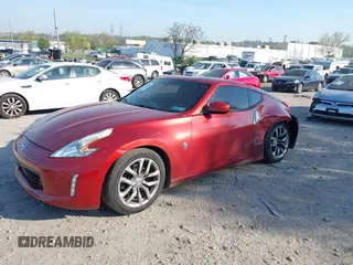 2014 Nissan 370Z Nismo with VIN JN1AZ4EH9EM636340, listed as a IAAI auction lot 42112548 with 143,894 mi miles and . Bid and sale history available at DreamBid. Image 2.