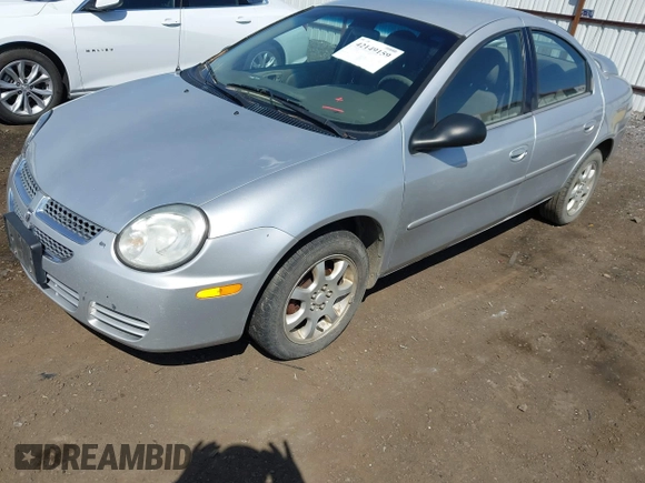 2005 Dodge Neon SXT with VIN 1B3ES56C75D273890, listed as a IAAI auction lot 42149159 with 212,741 mi miles. Bid and sale history available at carsss.com. Image 2.