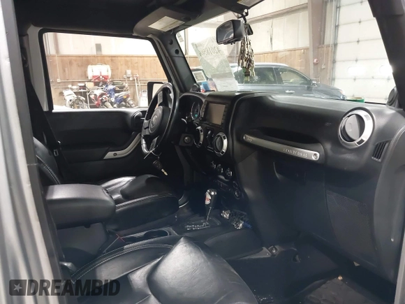 2014 Jeep Wrangler Unlimited Sahara with VIN 1C4BJWEG5EL164350, listed as a IAAI auction lot 42018586 with 113,222 mi miles. Bid and sale history available at carsss.com. Image 5.