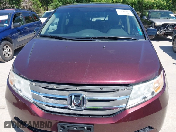 2011 Honda Odyssey EX-L with VIN 5FNRL5H60BB094647, listed as a IAAI auction lot 42223712 with 202,612 mi miles and . Bid and sale history available at carsss.com. Image 12.