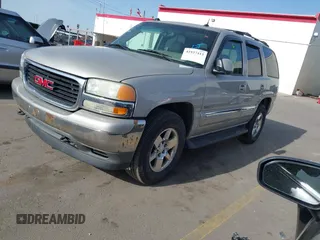 2005 GMC Yukon SLT with VIN 1GKEK13T15J118270, listed as a IAAI auction lot 41937413 with 218,057 mi miles. Bid and sale history available at carsss.com. Image 2.