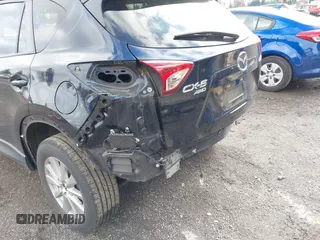 2015 Mazda CX-5 Touring with VIN JM3KE4CY5F0453646, listed as a IAAI auction lot 41740574 with 91,167 mi miles. Bid and sale history available at carsss.com. Image 6.