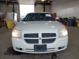 2006 Dodge Magnum z VIN 2D8GZ57286H100782, wystawiony jako IAAI lot #41816780 z przebiegiem 203 839 mil mil oraz . Historia ofert i sprzedaży dostępna na DreamBid. Obrazek 12.