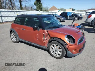2011 MINI Hardtop S with VIN WMWSV3C57BTY11831, listed as a Copart auction lot 51985845 with 70,690 mi miles and Salvage Title. Bid and sale history available at DreamBid. Image 4.