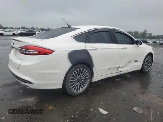 2017 Ford Fusion Titanium z VIN 3FA6P0SUXHR268559, wystawiony jako Copart lot #57456085 z przebiegiem 124 072 mil mil oraz Szkoda całkowita • Salvage title. Historia ofert i sprzedaży dostępna na DreamBid. Obrazek 3.