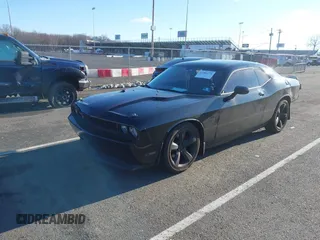 2013 Dodge Challenger R/T with VIN 2C3CDYBT6DH614418, listed as a IAAI auction lot 41583274 with 63,409 mi miles. Bid and sale history available at carsss.com. Image 2.