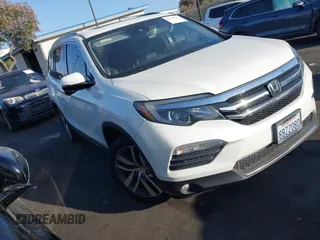 2017 Honda Pilot Touring with VIN 5FNYF6H96HB095958, listed as a IAAI auction lot 42519781 with 94,078 mi miles and . Bid and sale history available at DreamBid. Image 1.