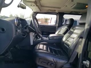 2005 Hummer H2 SUV with VIN 5GRGN23U35H111403, listed as a Copart auction lot 84720994 with 142,159 mi miles and Salvage Title. Bid and sale history available at carsss.com. Image 7.