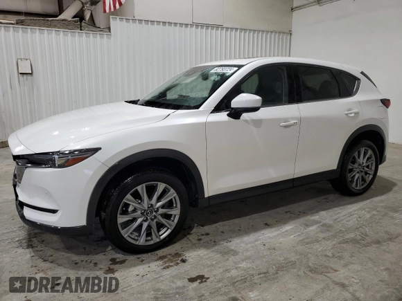 2021 Mazda CX-5 Grand Touring with VIN JM3KFBDM4M1344602, listed as a Copart auction lot 82793724 with 69,322 mi miles and Salvage Title. Bid and sale history available at carsss.com. Image 1.