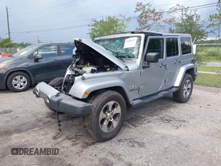 2016 Jeep Wrangler Unlimited Sahara with VIN 1C4BJWEG3GL240859, listed as a IAAI auction lot 42628937 with 103,378 mi miles and . Bid and sale history available at DreamBid. Image 17.