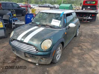 2010 MINI Hardtop with VIN WMWMF3C57ATZ24618, listed as a IAAI auction lot 42426752 with 68,973 mi miles and . Bid and sale history available at DreamBid. Image 2.