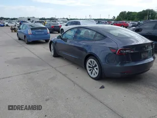 2021 Tesla Model 3 Long Range with VIN 5YJ3E1EB4MF855581, listed as a IAAI auction lot 41974515 with 71,561 mi miles. Bid and sale history available at carsss.com. Image 3.