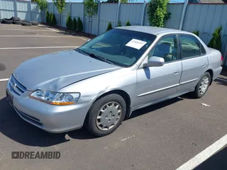 2002 Honda Accord LX with VIN 1HGCG56422A167829, listed as a IAAI auction lot 42401497 with 221,550 mi miles and . Bid and sale history available at DreamBid. Image 2.