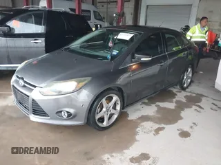 2013 Ford Focus Titanium with VIN 1FADP3J20DL189239, listed as a IAAI auction lot 42122324 with 116,917 mi miles and . Bid and sale history available at carsss.com. Image 2.