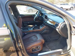 2011 Audi A8 with VIN WAURVAFDXBN014290, listed as a IAAI auction lot 40860777 with 152,584 mi miles and . Bid and sale history available at DreamBid. Image 5.