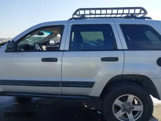 2005 Jeep Grand Cherokee Laredo with VIN 1J4HR48N45C628711, listed as a IAAI auction lot 42004501 with 147,047 mi miles. Bid and sale history available at carsss.com. Image 14.