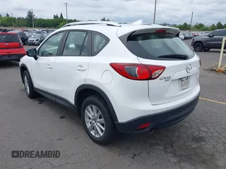 2016 Mazda CX-5 Sport with VIN JM3KE4BY7G0764563, listed as a IAAI auction lot 42279993 with 128,950 mi miles and . Bid and sale history available at DreamBid. Image 3.