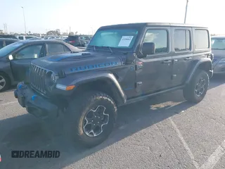 2023 Jeep Wrangler Rubicon with VIN 1C4JJXR67PW662277, listed as a IAAI auction lot 41950065 with 35,714 mi miles and . Bid and sale history available at DreamBid. Image 2.