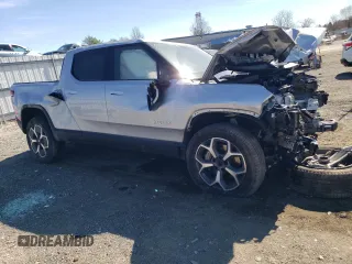 2023 Rivian R1T Adventure with VIN 7FCTGBAA8PN027711, listed as a Copart auction lot 49449155 with 16,031 mi miles and Salvage Title. Bid and sale history available at carsss.com. Image 4.