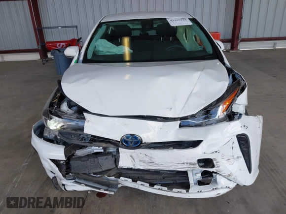 2021 Toyota Prius L Eco z VIN JTDKAMFU5M3146342, wystawiony jako IAAI lot #42249219 z przebiegiem 49 810 mil mil oraz . Historia ofert i sprzedaży dostępna na DreamBid. Obrazek 12.