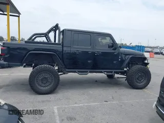 2020 Jeep Gladiator Rubicon z VIN 1C6JJTBG7LL102189, wystawiony jako IAAI lot #42320968 z przebiegiem 68 266 mil mil oraz . Historia ofert i sprzedaży dostępna na DreamBid. Obrazek 13.
