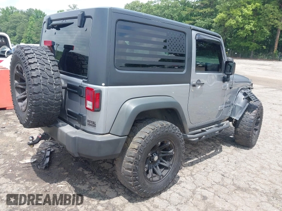 2016 Jeep Wrangler Black Bear with VIN 1C4AJWAG5GL258426, listed as a IAAI auction lot 42400914 with 128,606 mi miles and . Bid and sale history available at DreamBid. Image 4.