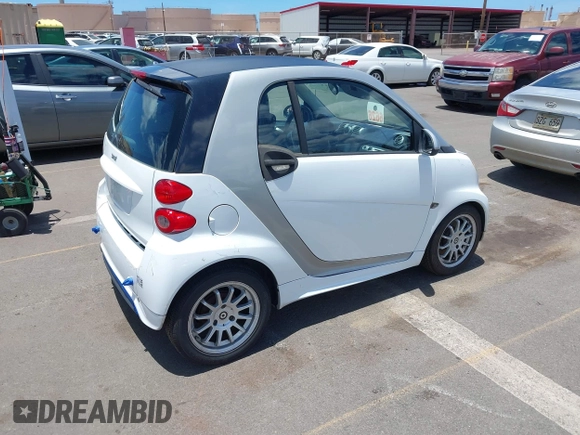 2013 Smart fortwo Pure with VIN WMEEJ3BA8DK605597, listed as a IAAI auction lot 42395754 with 55,637 mi miles and . Bid and sale history available at DreamBid. Image 4.