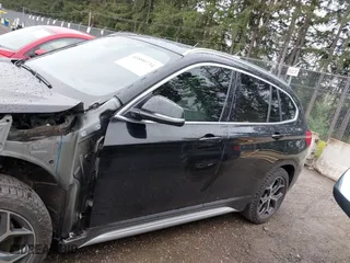 2018 BMW X1 xDrive28i with VIN WBXHT3C39J3H30531, listed as a IAAI auction lot 41890734 with 59,147 mi miles. Bid and sale history available at carsss.com. Image 15.