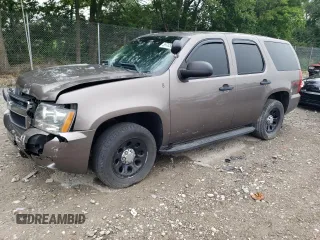 2014 Chevrolet Tahoe Commercial with VIN 1GNLC2E00ER143095, listed as a Copart auction lot 59703815 with 165,061 mi miles and Salvage title. Bid and sale history available at DreamBid. Image 1.