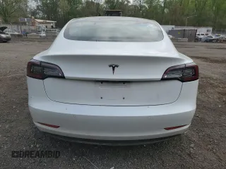 2018 Tesla Model 3 Long Range Battery with VIN 5YJ3E1EAXJF165000, listed as a Copart auction lot 53806195 with 140,448 mi miles and Clean Title. Bid and sale history available at DreamBid. Image 6.