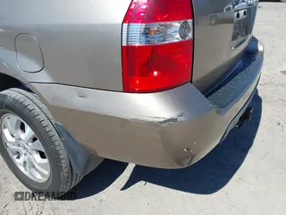 2003 Acura MDX Touring Pkg with VIN 2HNYD18623H549599, listed as a IAAI auction lot 41879934 with 242,896 mi miles. Bid and sale history available at carsss.com. Image 12.