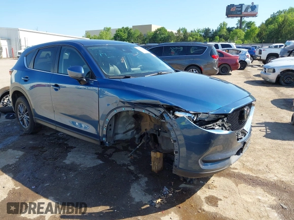 2020 Mazda CX-5 Touring z VIN JM3KFBCM2L0848233, wystawiony jako IAAI lot #42189719 z przebiegiem 80 893 mil mil oraz . Historia ofert i sprzedaży dostępna na DreamBid. Obrazek 1.