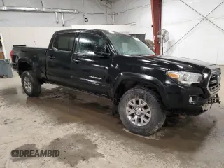 2017 Toyota Tacoma SR5 with VIN 5TFDZ5BN5HX028165, listed as a Copart auction lot 52676445 with 114,824 mi miles and Salvage Title. Bid and sale history available at carsss.com. Image 4.