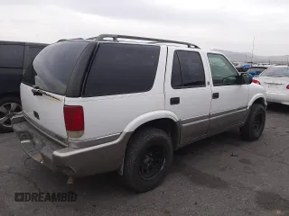 1999 GMC Jimmy SLE with VIN 1GKDT13W1X2551085, listed as a Copart auction lot 50553055 with 189,974 mi miles and Salvage Title. Bid and sale history available at carsss.com. Image 3.