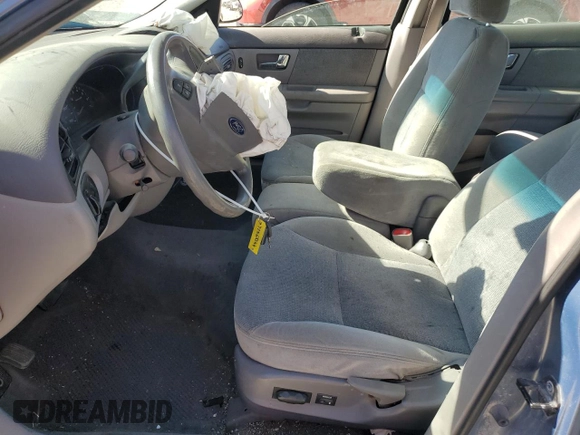 2000 Ford Taurus SE with VIN 1FAFP53U3YG259124, listed as a Copart auction lot 77363344 with 154,889 mi miles and Salvage Title. Bid and sale history available at DreamBid. Image 7.