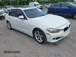 2015 BMW 3 Series 328i with VIN WBA3A5C50FF608327, listed as a IAAI auction lot 42136156 with 213,945 mi miles. Bid and sale history available at carsss.com. Image 1.