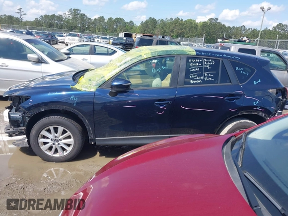 2016 Mazda CX-5 Touring with VIN JM3KE4CY0G0916908, listed as a IAAI auction lot 41848823 with 53,255 mi miles. Bid and sale history available at carsss.com. Image 14.
