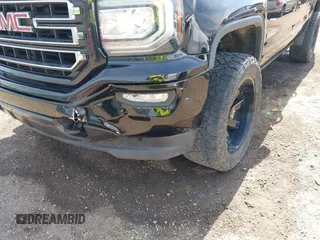 2017 GMC Sierra 1500 SLE z VIN 1GTV2MEC2HZ105964, wystawiony jako IAAI lot #42091941 z przebiegiem 93 779 mil mil oraz . Historia ofert i sprzedaży dostępna na DreamBid. Obrazek 6.