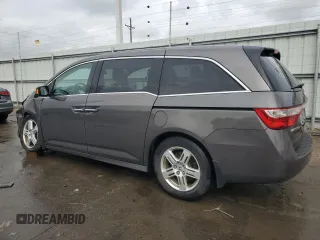 2012 Honda Odyssey Touring with VIN 5FNRL5H94CB109257, listed as a Copart auction lot 59636075 with 107,543 mi miles and Salvage title. Bid and sale history available at DreamBid. Image 2.